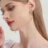 Juicy Grape new Chinese earrings peacock plume long tassel earrings female ear clip enamel earrings female gift - Image 3